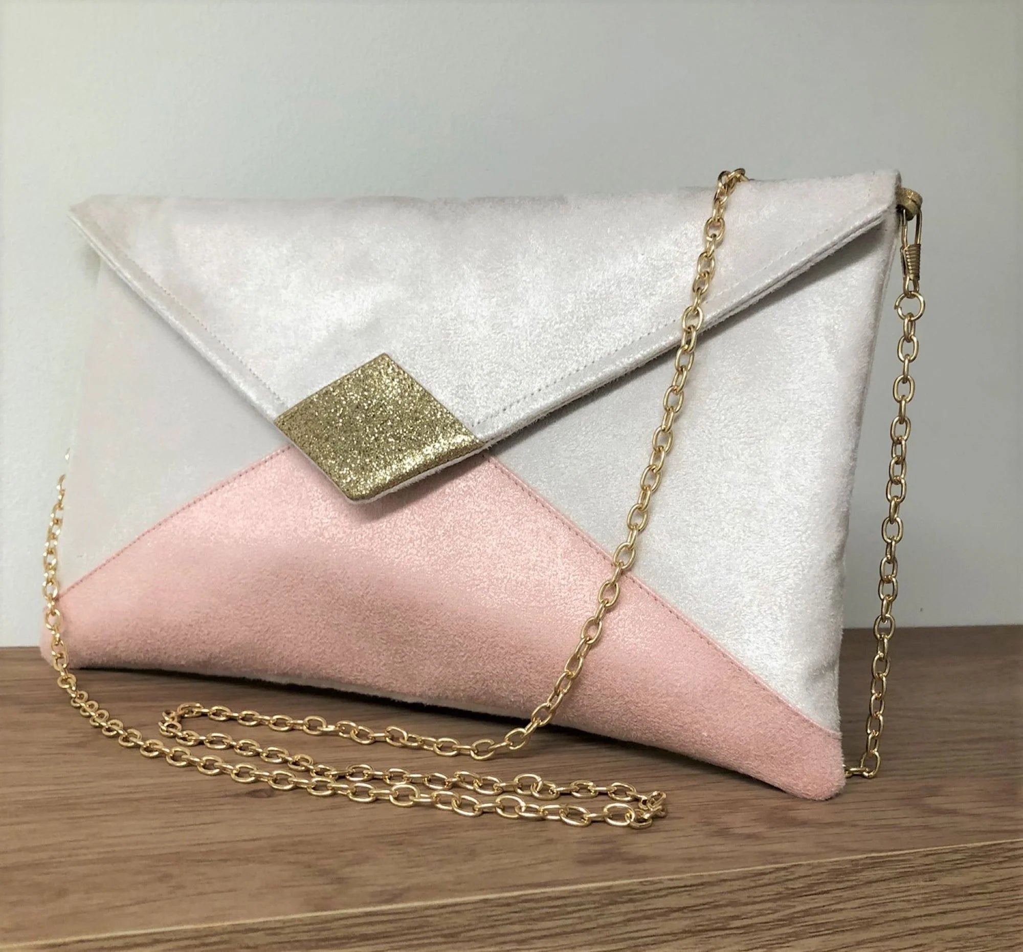 Pink and top gold clutch bag