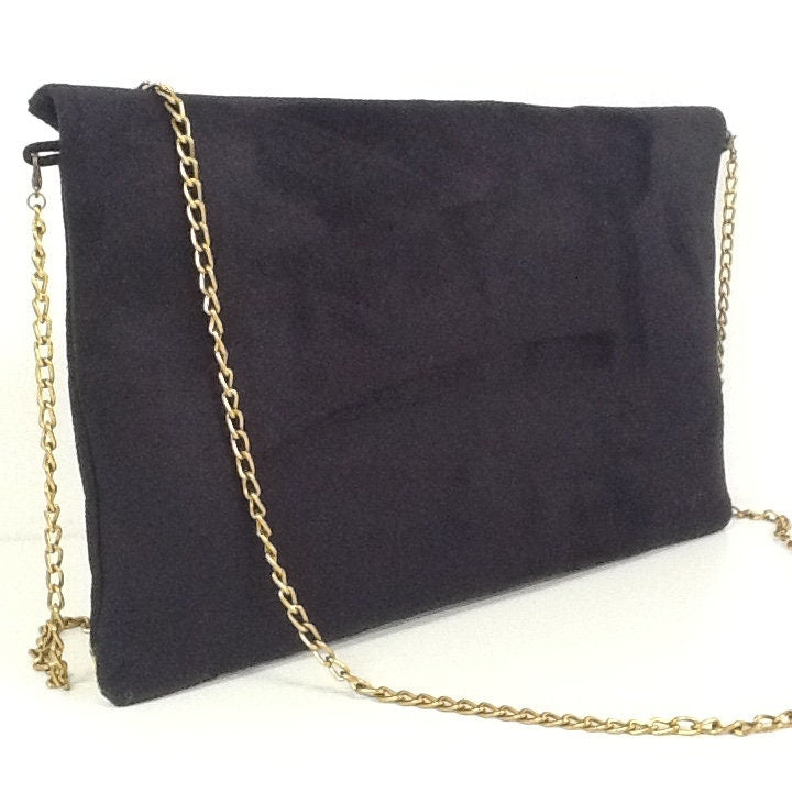 Sac pochette Isa noir et léopard à paillettes dorées