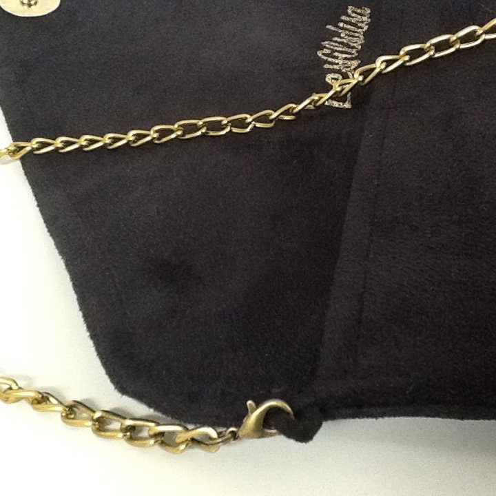 Sac pochette Isa noir et léopard à paillettes dorées