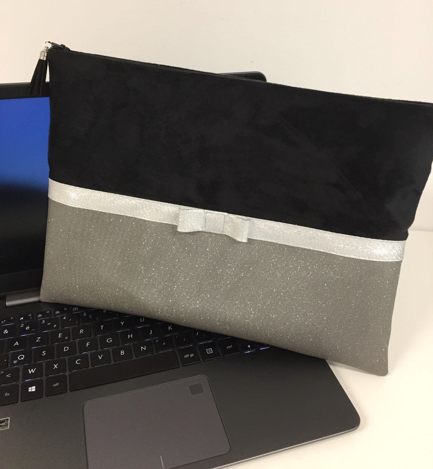 Black and gray laptop bag with silver bow