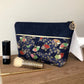 La pochette à maquillage bleu marine en tissu japonais Sakura éventails