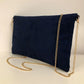 le sac pochette Isa bleu marine et orange à paillettes dorées, avec chainette amovible, vue de dos.