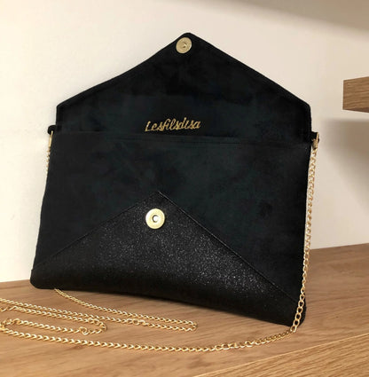 Le sac pochette Isa noir à paillettes noires ouvert, avec chainette dorée