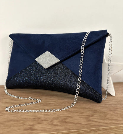 Le Le sac pochette Isa à paillettes bleu marine et argentées, face avant.