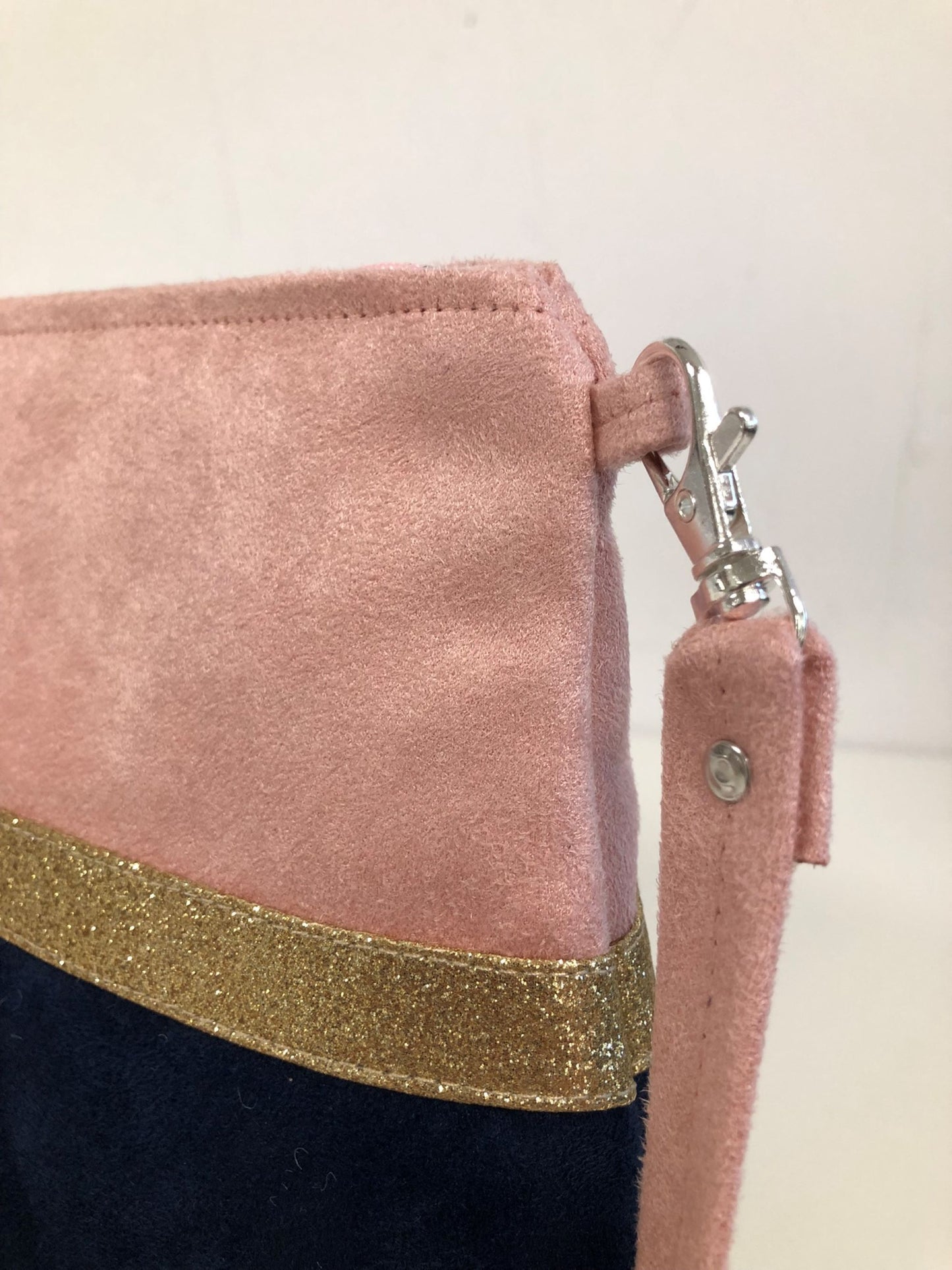 The powder pink and navy blue Isa shoulder bag with gold sequins