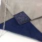Isa clutch bag in taupe gray and navy blue with sequins