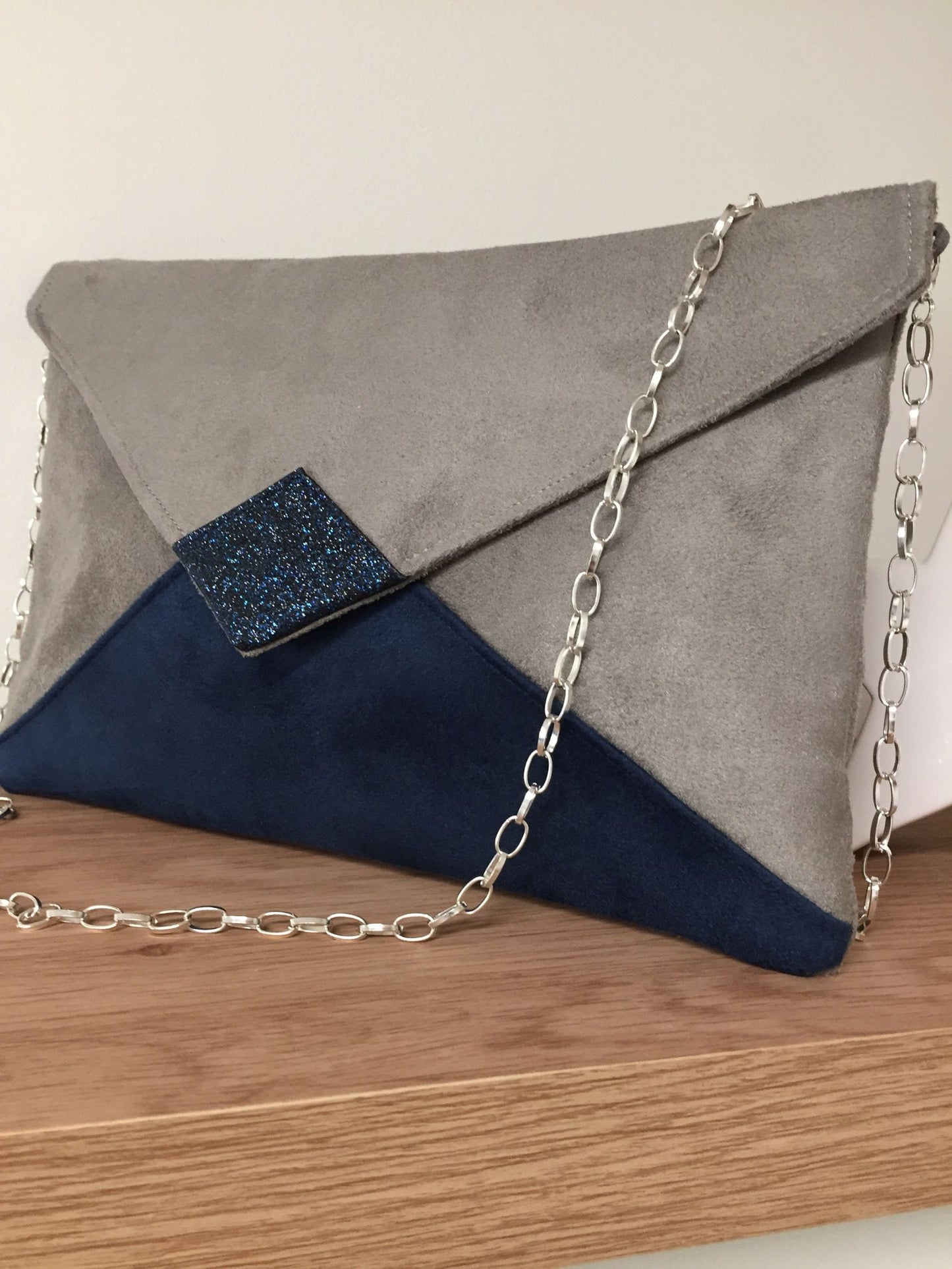 Isa clutch bag in taupe gray and navy blue with sequins