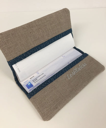 Beige and navy blue sequined checkbook holder with silver trim