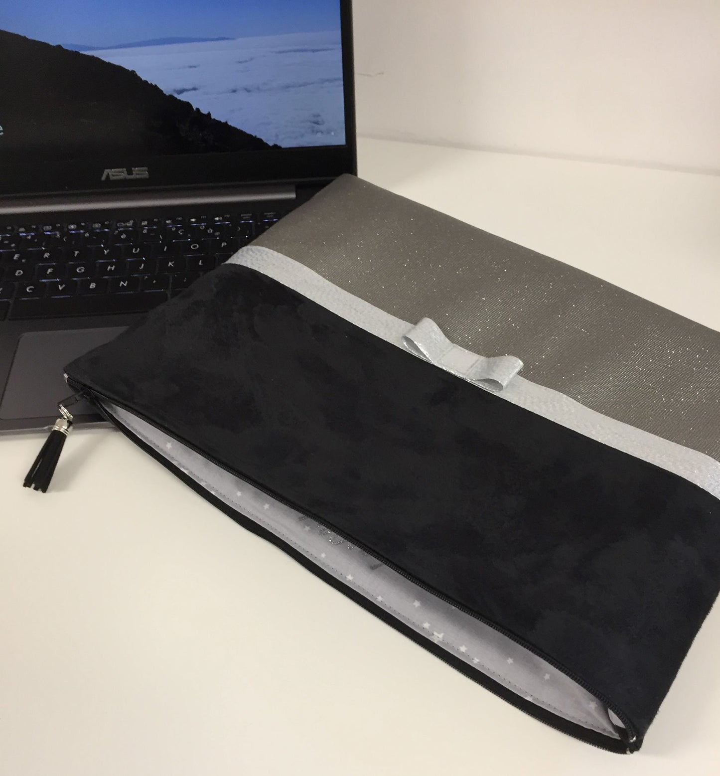 Black and gray laptop bag with silver bow