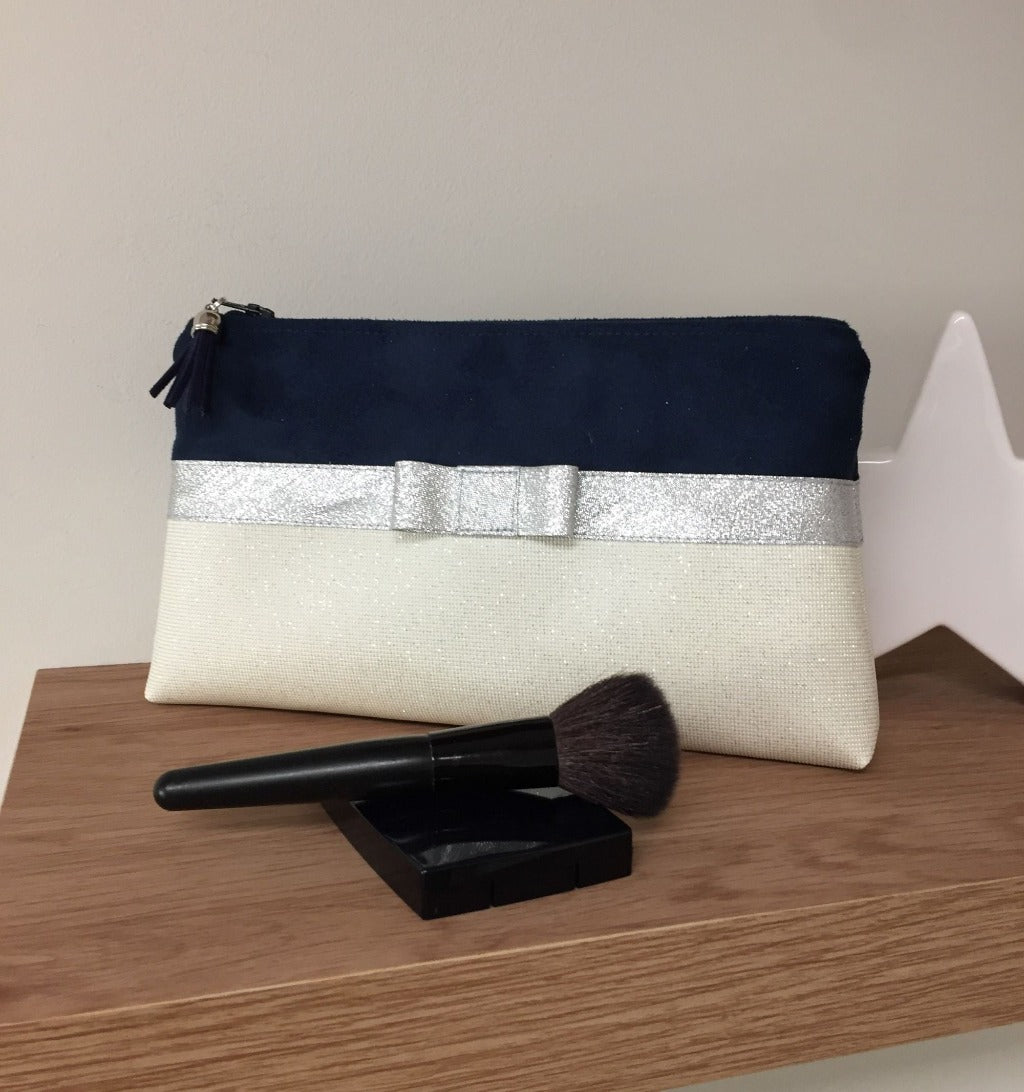 Navy and white makeup pouch with silver bow