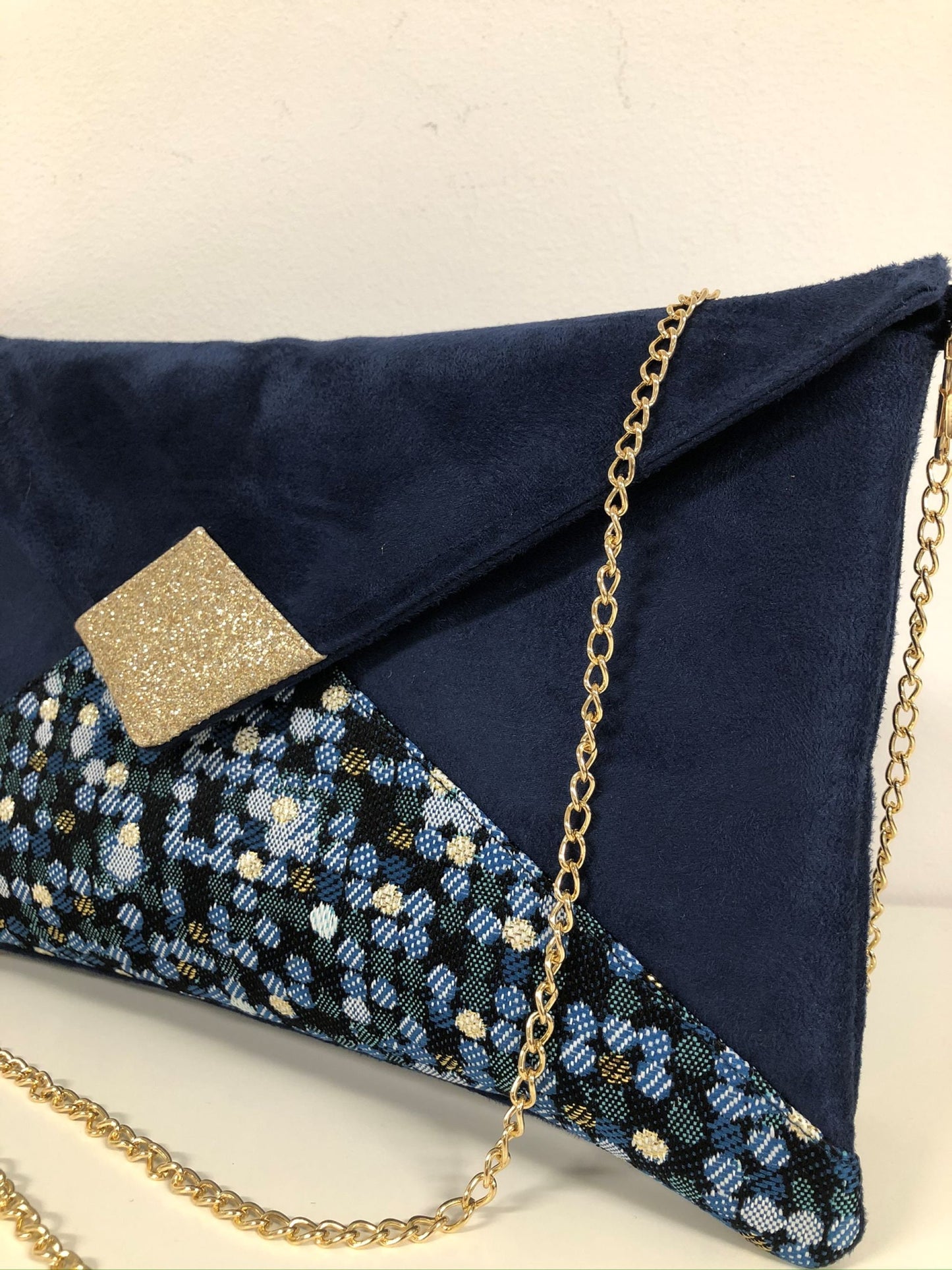 Isa clutch bag in navy blue and duck blue with gold sequins