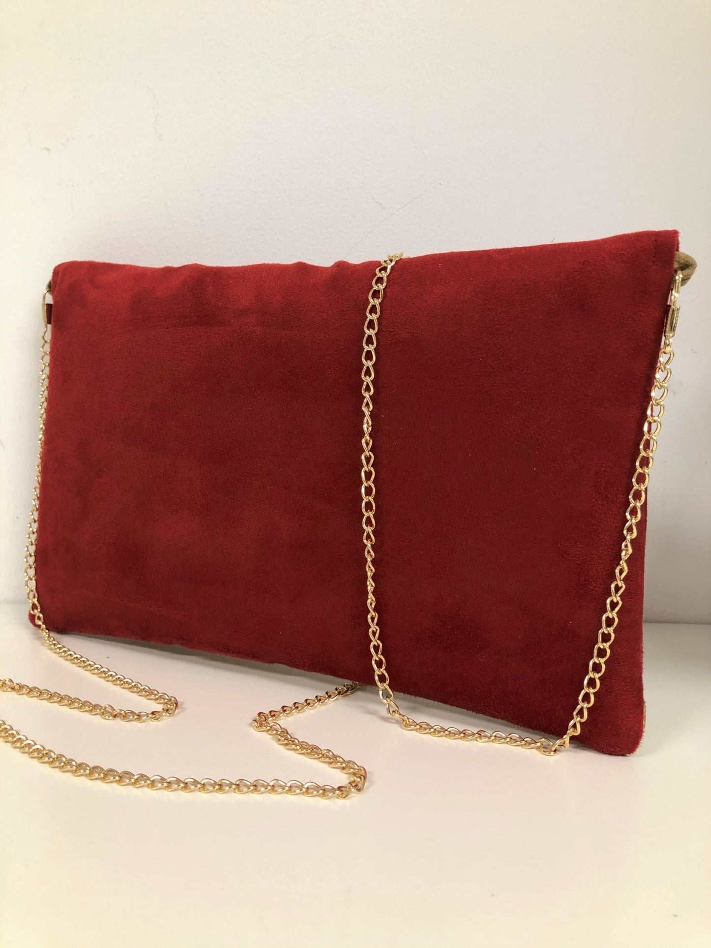 Red Isa clutch bag with gold sequins