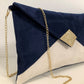 Isa clutch bag in navy blue and ecru with gold sequins
