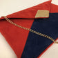 Red and navy blue Isa clutch bag with gold sequins