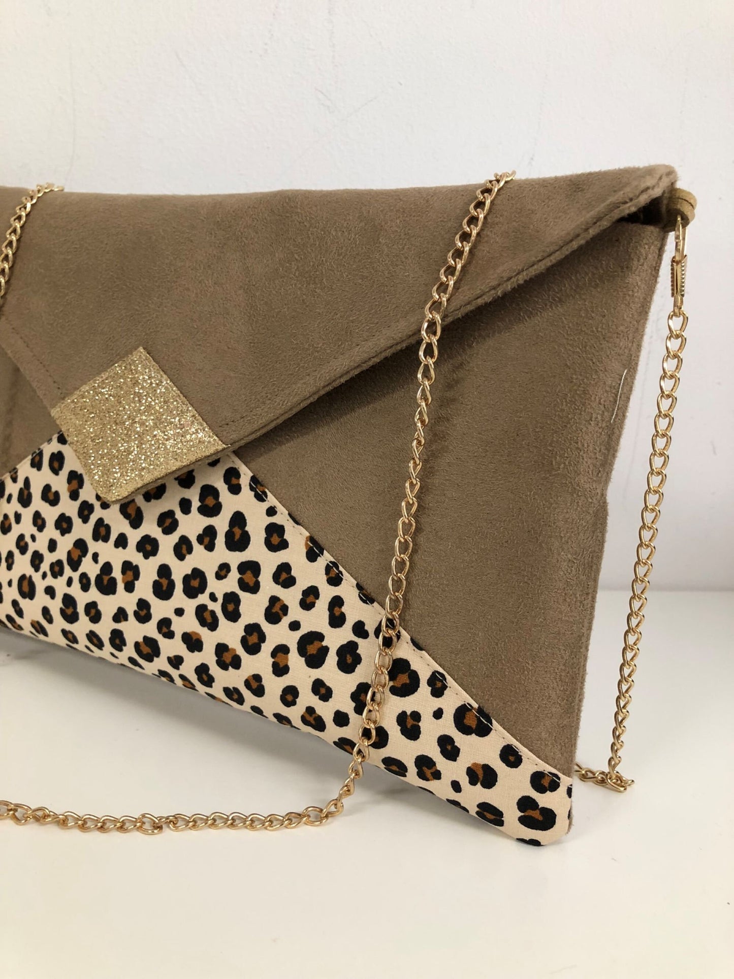 Isa camel clutch bag with animal motif and gold sequins