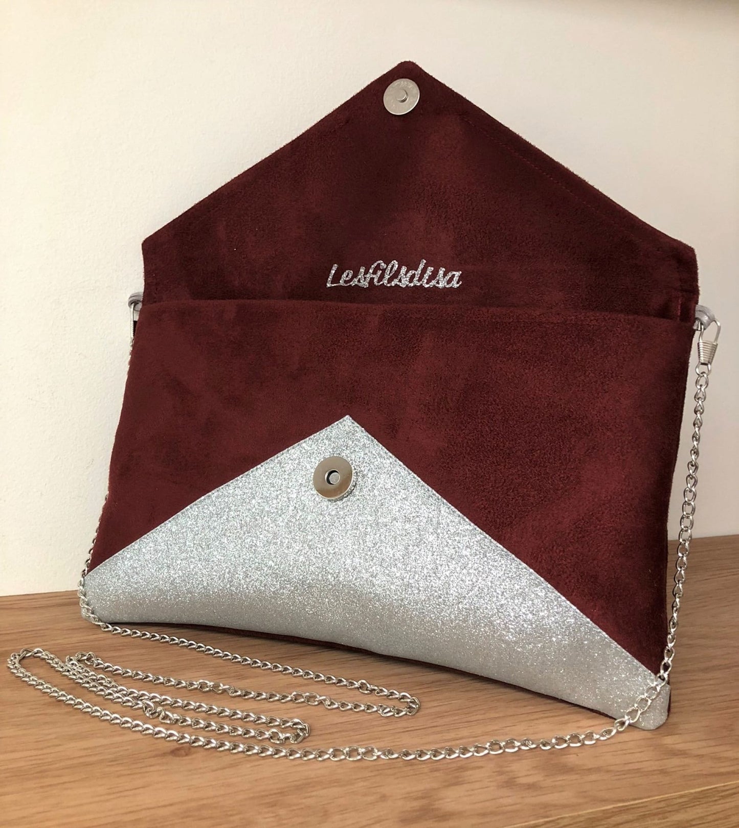 Isa burgundy clutch bag with silver sequins