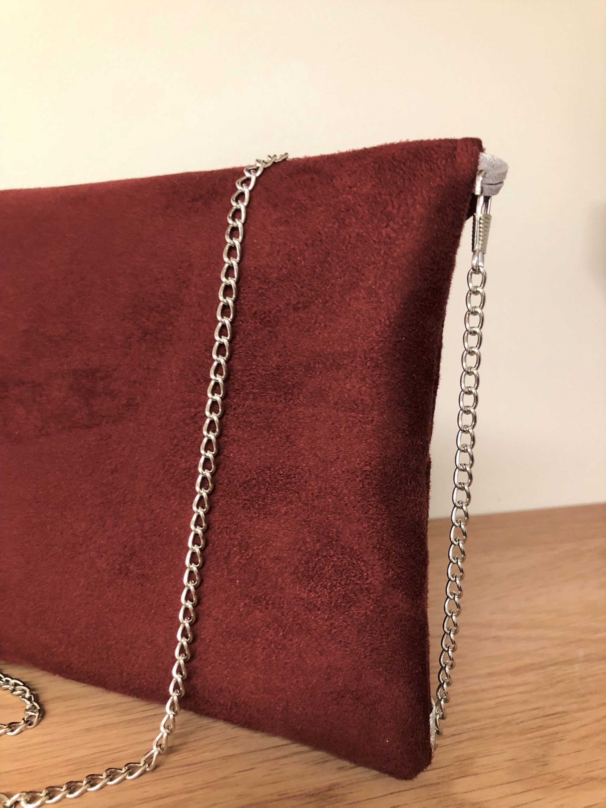 Burgundy suede 2024 clutch bag