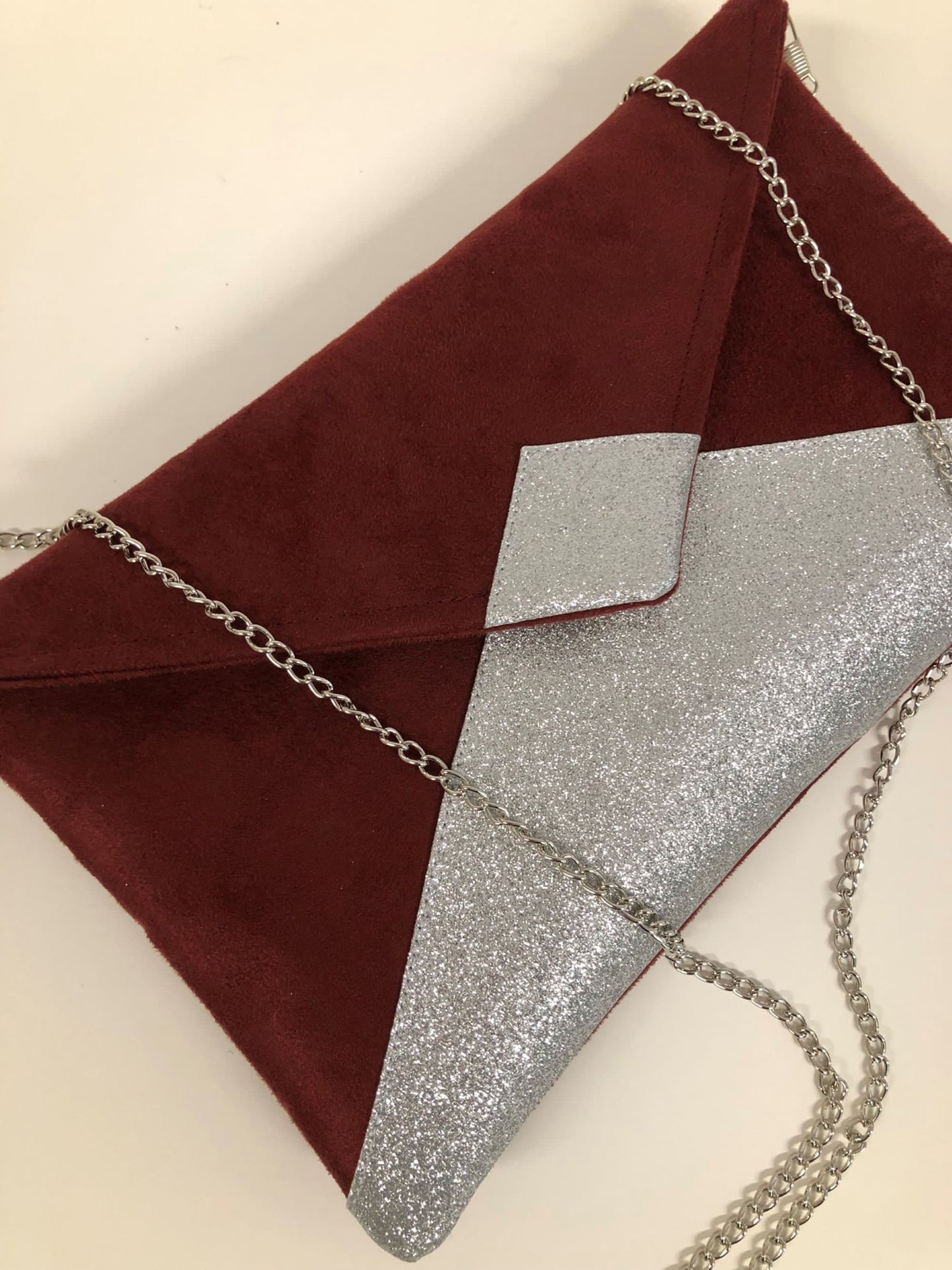 Isa burgundy clutch bag with silver sequins