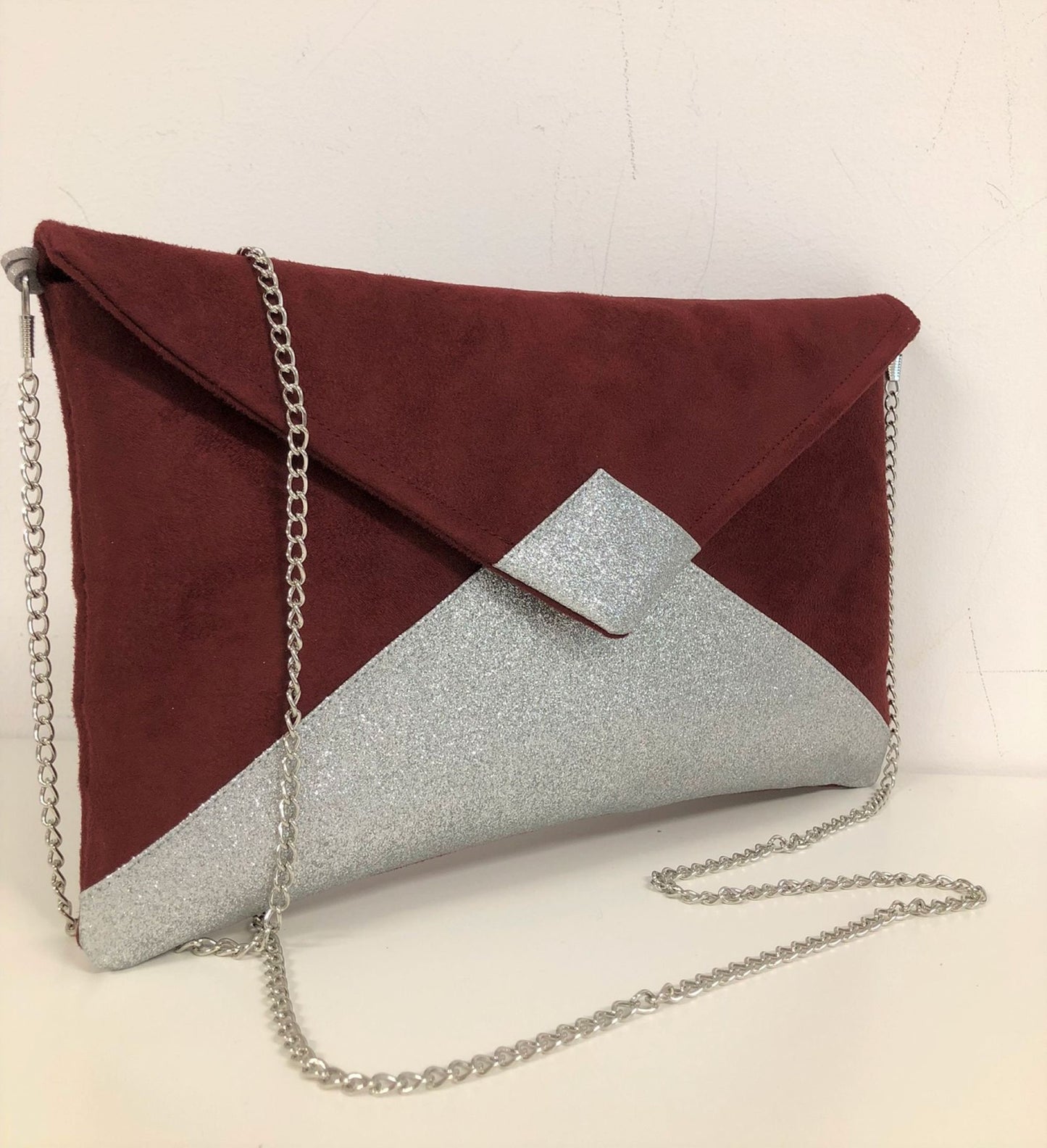 Isa burgundy clutch bag with silver sequins