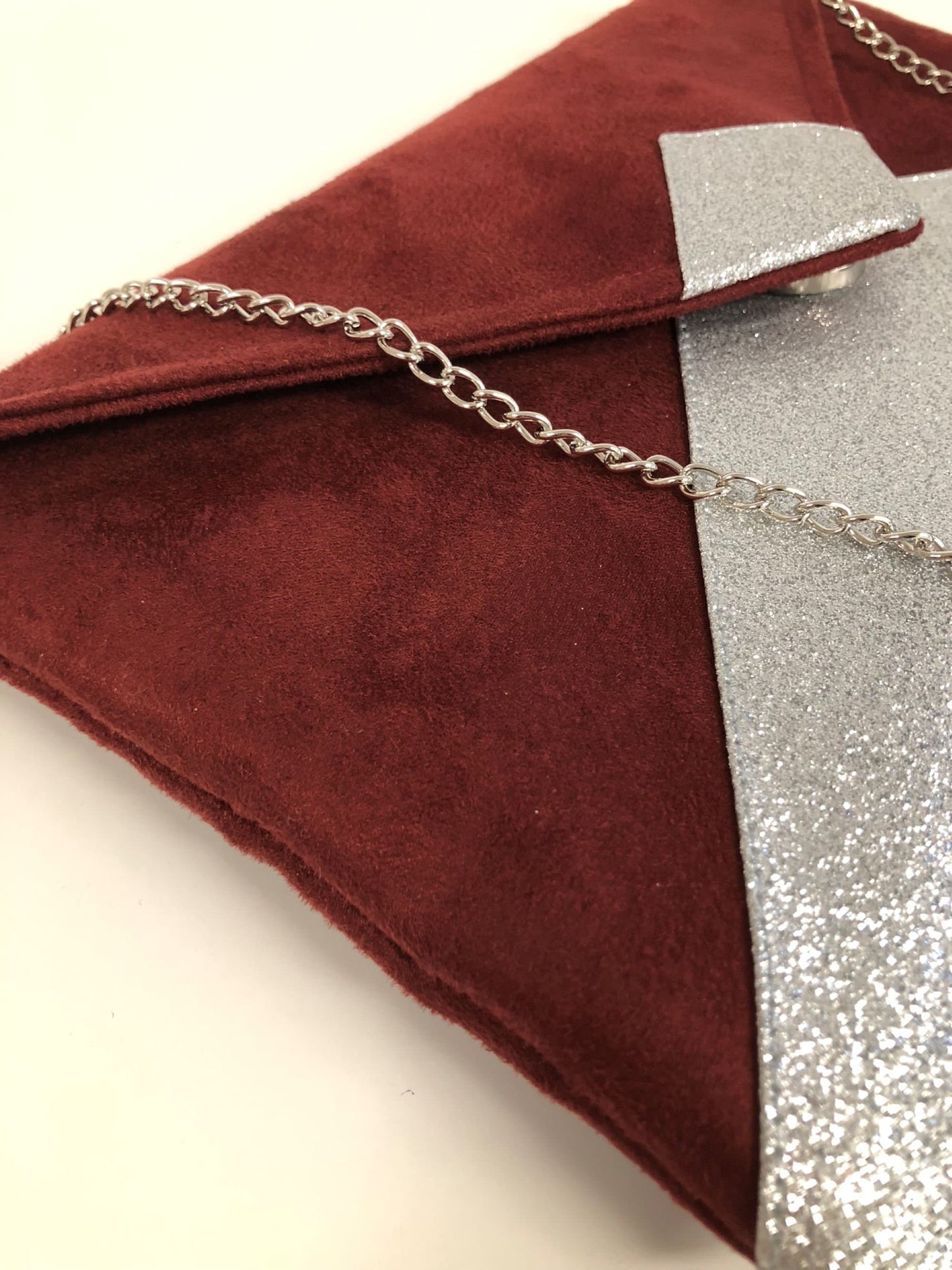 Isa burgundy clutch bag with silver sequins